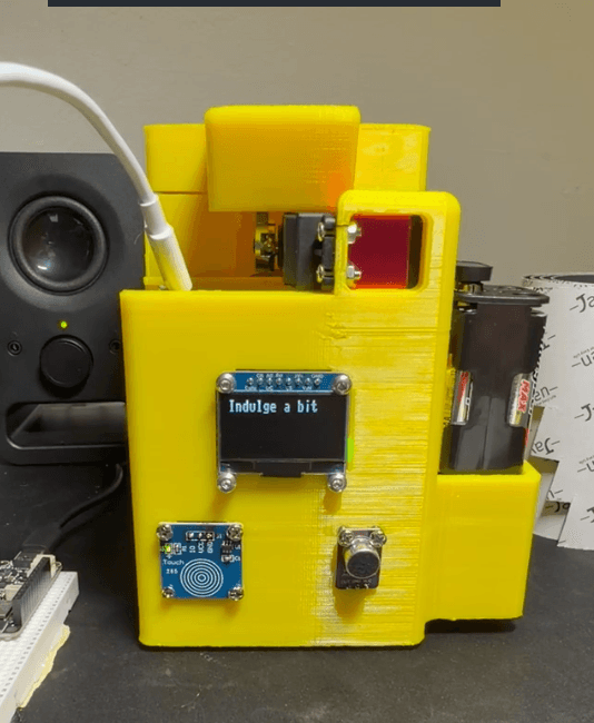 Final Soda Can Prevention Device prototype with OLED screen and yellow enclosure