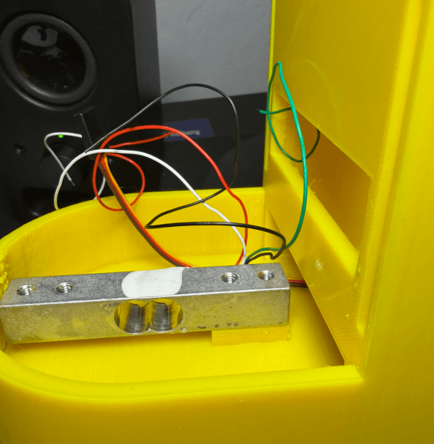 Load cell placed inside the can holder area of the Soda Can Prevention Device
