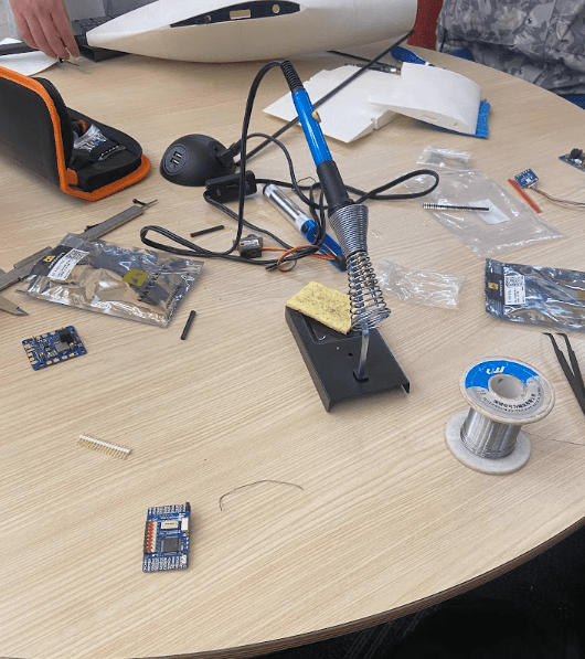 Soldering workstation with drone electronics and tools